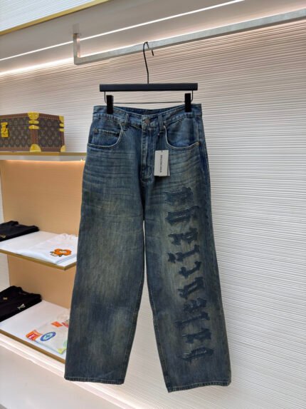 Balenciaga Distressed Trousers with Logo Patch