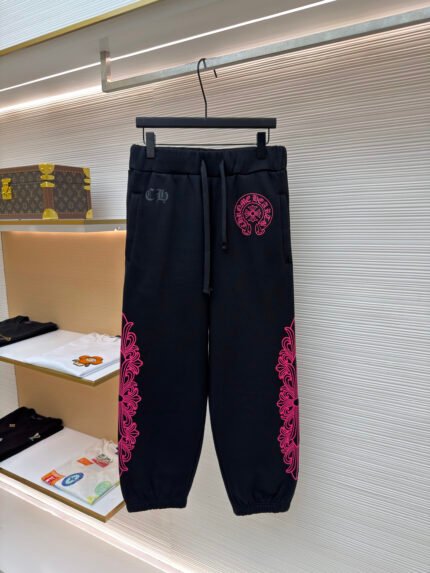 Chrome Hearts Joggers with Fluorescent Pink Sanskrit Lettering on the Side